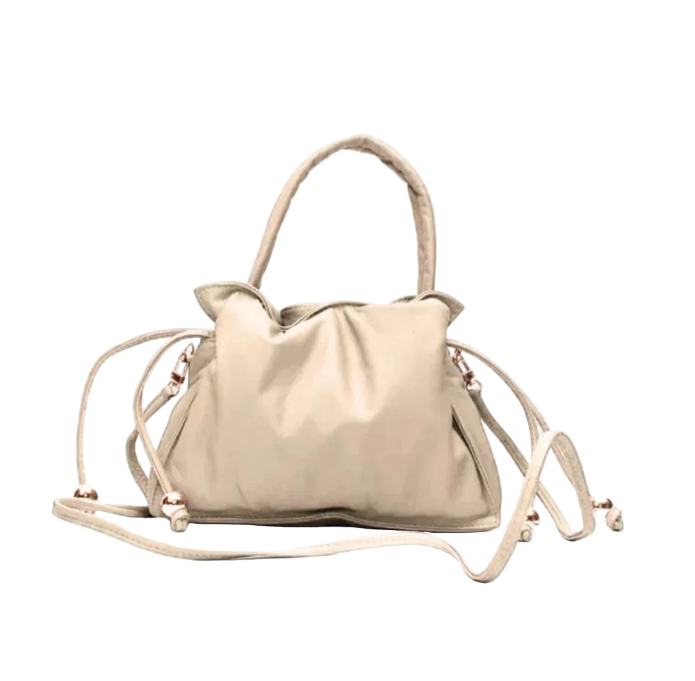 Beige handbag with a strap on a white background