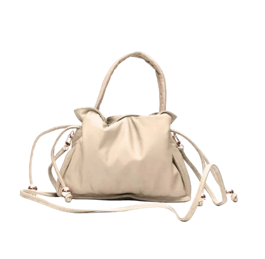 Beige handbag with a strap on a white background