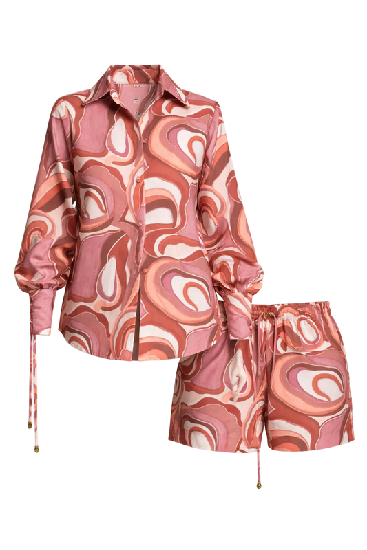 Pink and white patterned jacket and shorts set on a white background