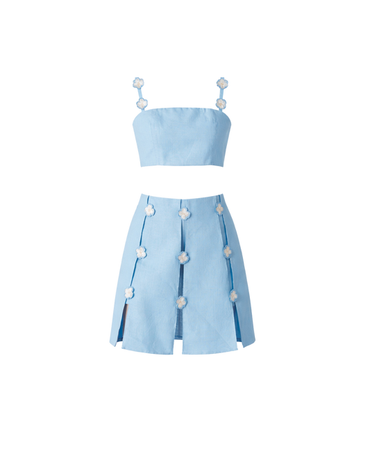 Light blue two-piece outfit with a top and skirt on a white background